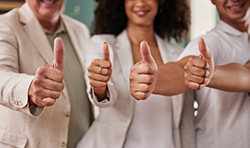 Group of real estate agents for homes for sale in East Brunswick with thumbs all up